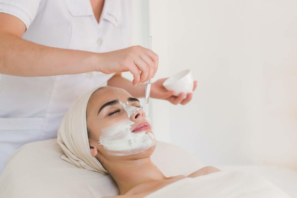 medical facial treatment done applying a mask on a woman's face