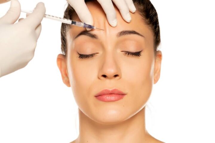 Injectable Botox performed in the forehead of a woman