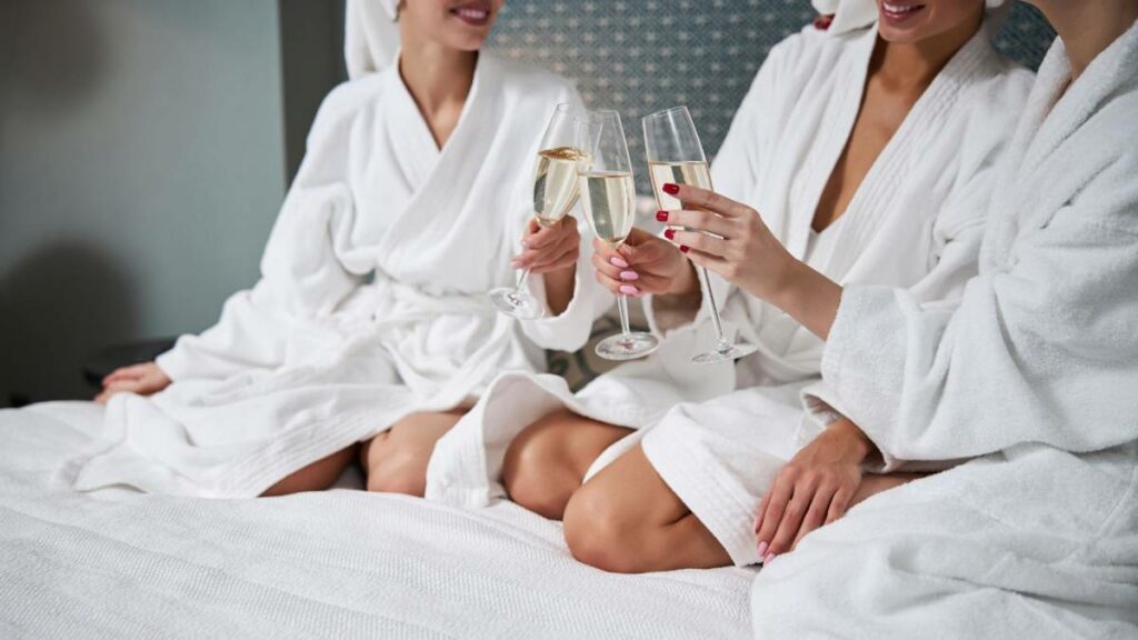 three women benifiting of the BodyTonic membership and enjoying a glass of champagne