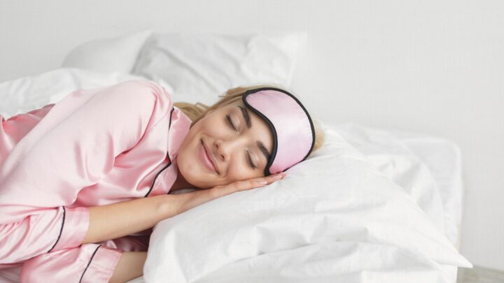 a woman sleeping in bed